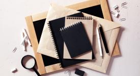 books with magnifying glass