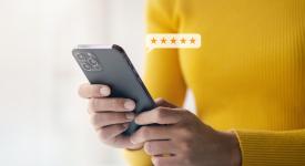 person using phone giving 5 stars in review